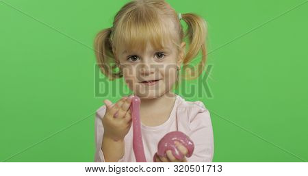 Child Having Fun Making Ping Slime. Kid Playing With Hand Made Toy Slime. Funny Kid Girl. Relax And 