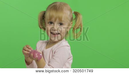 Child Having Fun Making Ping Slime. Kid Playing With Hand Made Toy Slime. Funny Kid Girl. Relax And 