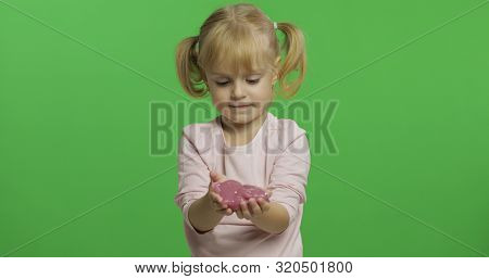 Child Having Fun Making Ping Slime. Kid Playing With Hand Made Toy Slime. Funny Kid Girl. Relax And 