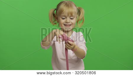Child Having Fun Making Ping Slime. Kid Playing With Hand Made Toy Slime. Funny Kid Girl. Relax And 