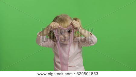 Child Having Fun Making Ping Slime. Kid Playing With Hand Made Toy Slime. Funny Kid Girl. Relax And 