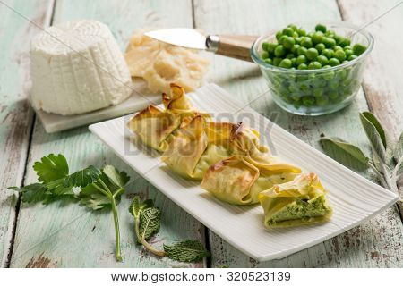 fagottini filled with ricotta parmesan cheese and green peas