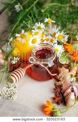 Jar Of Organic Honey, Lemon, Garlic Root, Anise, Fresh Flowers Camomile And Calendula. Concept Of Al