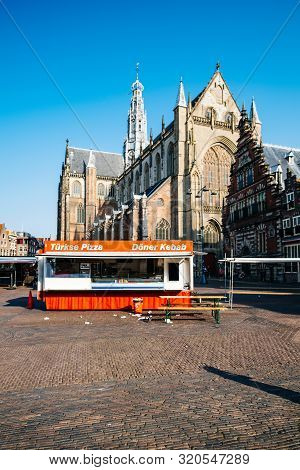 Haarlem, Netherlands - Aug 26, 2019: Front View Of Doner Kebab And Turkish Pizza Turkse In Front Of 