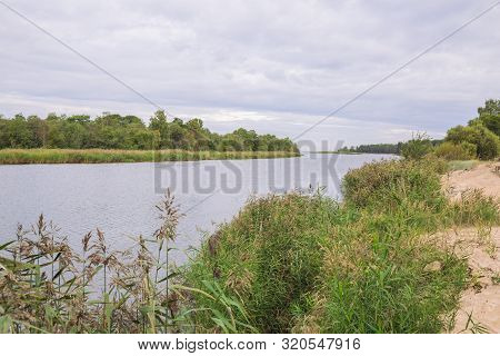 City Carnikava, Latvian Republic. Green Nature In Summer With River Gauja And Waves. Travel Photo. S