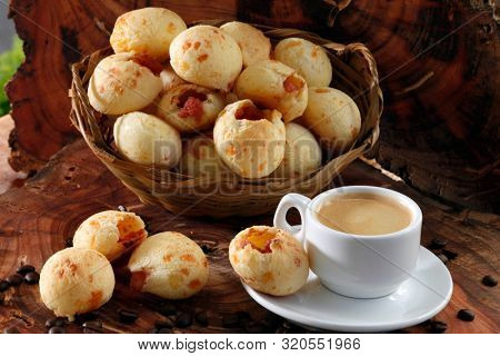 Brazilian snack cheese bread, pao de queijo, Brazilian snack cheese bread stuffed with pepperoni and a cup of coffee