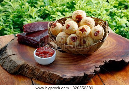 Brazilian snack cheese bread, pao de queijo stuffed with guava