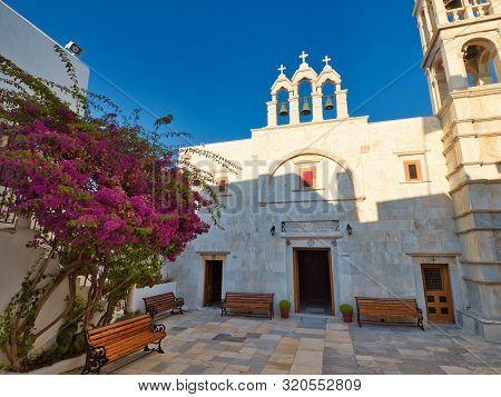 Ano Mera, Mykonos, Greece - July 23 2019 Low Angle Of Historic Stone Building Of Monastery Of Panagi