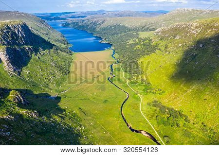 Aerial View Of The Glenveagh National Park With Castle Castle And Loch In The Background - County Do