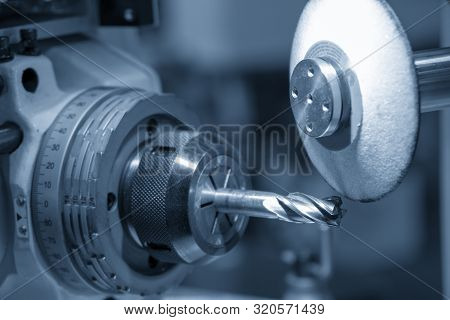 The Cnc Cutting Tool Grinding Machine Control By Cnc Program. The Milling Cutting Tool Regrinding Pr