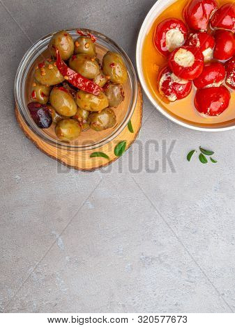 Italian Food Ingredients Background With Olives, Oil Red Stuffes With Cheese Bell Peppers