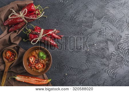 Spicy Chili On A Dark Background In Ceramic Plates, Flatlay. Used As An Ingredient For Harissa, Ajik