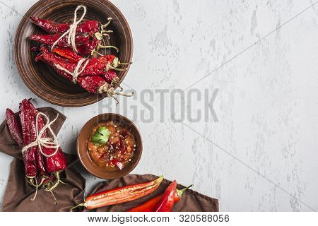 Spicy Chili On A Light Background, Flatlay. Used As An Ingredient For Harissa, Ajika, Muhammara. Eas