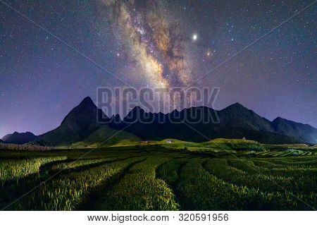 Fansipan Mountain Hills Valley On Summer With Milky Way And Paddy Rice, Agricultural Fields At Night