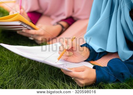 Muslim Students Wearing Hijab Speaking And Studying Together