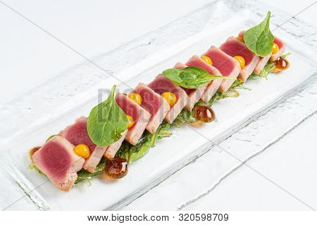 sliced steak fof tuna with sauce
