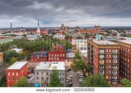 Savannah, Georgia, USA downtown city skyline at dusk.