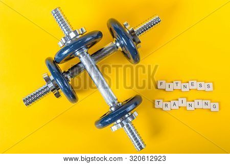 Healthcare Concept Showing Dumbbells And The Message Fitness Training