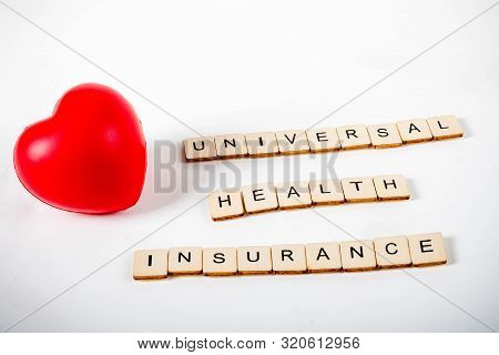 Healthcare Concept Showing A Heart And The Message Universal Health Insurance