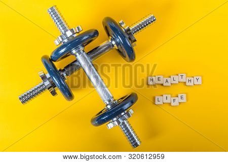 Healthcare Concept Showing Dumbbells And The Message Healthy Life