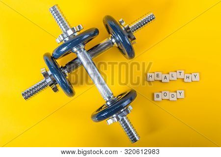 Healthcare Concept Showing Dumbbells And The Message Healthy Body