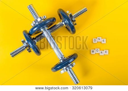 Healthcare Concept Showing Dumbbells And The Message One More
