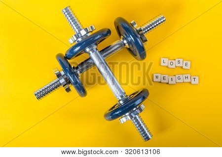 Healthcare Concept Showing Dumbbells And The Message Lose Weight