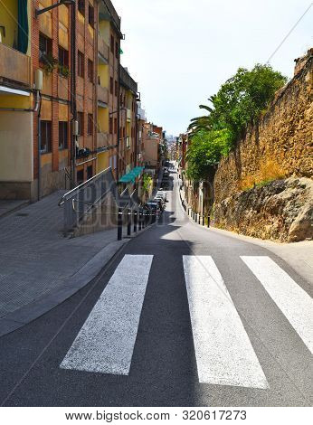 Colorful Street Near Park Guell. Residential District Of Barcelona, Catalonia. Narrow Street With St