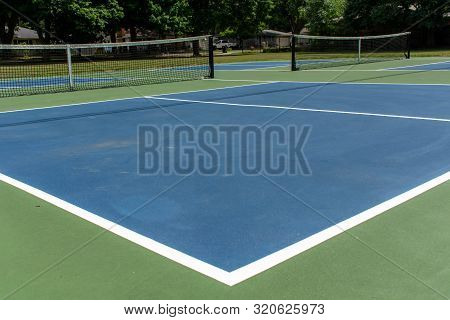 Recreational Sport Of Pickleball Court In Michigan, Usa Looking At An Empty Blue And Green New Court