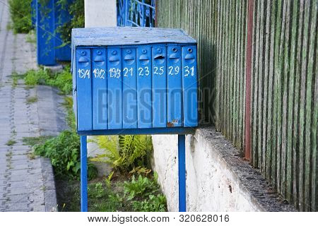 Old Retro Blue Mailbox On City Street