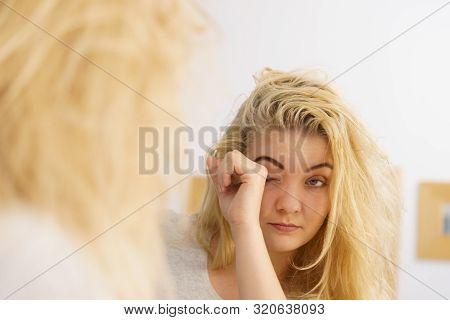 Young Blonde Female Feeling Dull And Tired After Waking Up. Woman Yawning Being Sleepy In Bathroom.