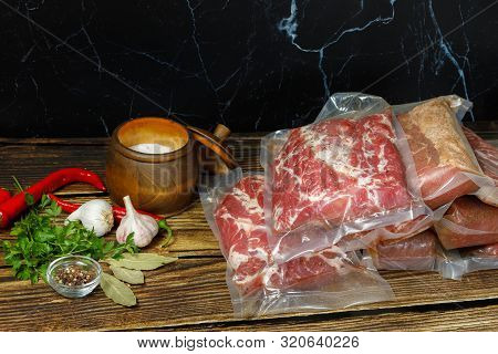 Cooking Meat In Packages Of The Sous Vide Technology. The Meat In The Package With Spices.