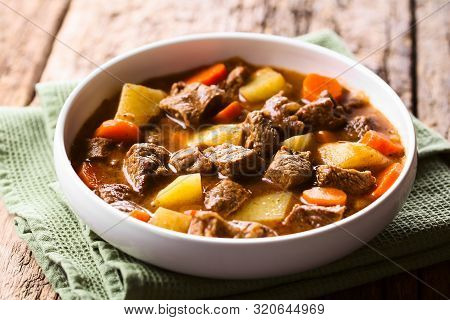 Fresh Homemade Beef Stew With Carrot And Potatoes Served In Bowl (selective Focus, Focus In The Midd