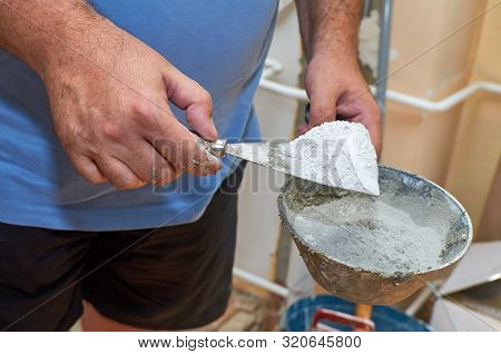 Scraper And Plasterer's Scoop With Gypsum Powder