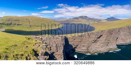 Panoramic View Of The Traelanipan Cliff And Sorvagsvatn Lake at Sunny Day, Vagar, Faroe Islands, Denmark.  - A Lake Above the Ocean