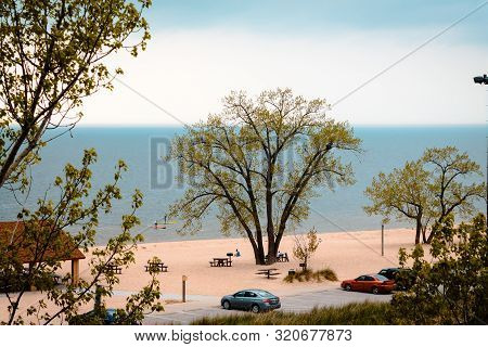 Looking Down At Tourist Enjoying Lake Michigan From The Sand Dune