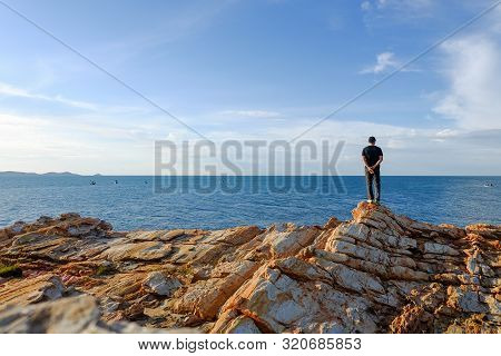 One Man Stood Holding His Hand Behind Him And Standing At The Viewpoint At Khao Laem Ya, Rayong, Tha