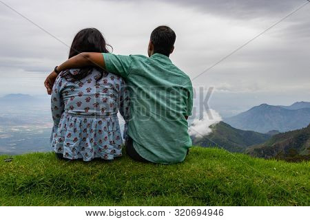 Couple Isolated Soaking Up Natural Beauty From Hill Top Image Is Showing The Human Love Towards The 