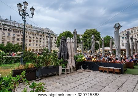 Thessaloniki, Greece - August 15 2019: People Enjoying Coffee At City Center Cafe Bars. Crowd Drinki