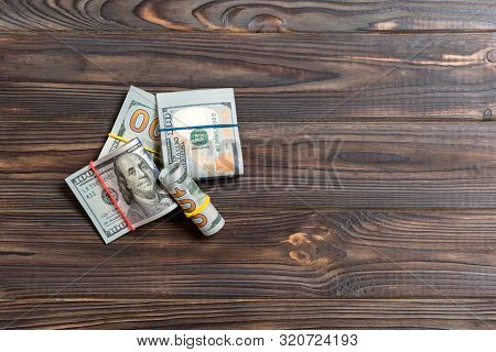 Stacks Of One Hundred Dollars Banknotes Close-up On Colored Background Business Concept Top View Wit