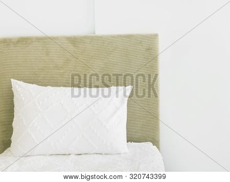 Fragment Of Bedroom Interior In Luxurious Hotel Bed With Upholstered Velour Bedhead Board White Pill