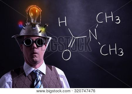 Nerd Presenting Handdrawn Chemical Formula Of Dimethylformamide