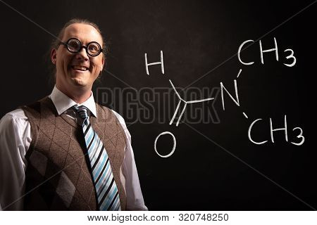Professor Presenting Handdrawn Chemical Formula Of Dimethylformamide