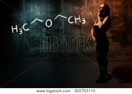 Sexy Girl Or Secretary Or Female Student Presenting Handdrawn Chemical Formula Of Diethylether