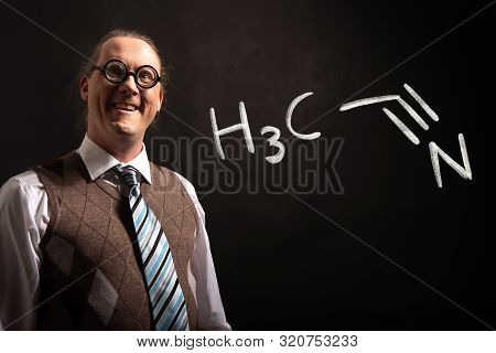 Professor Presenting Handdrawn Chemical Formula Of Acetone