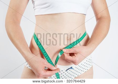 Woman Body After Weight Loss. Cropped Close Up Photo Of Fatless Slender Body Parts And Proportions W