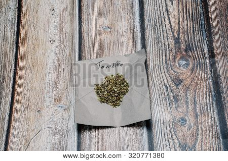 Thyme, Indian Spices On Paper With Your Name In Spanish On Wooden Background