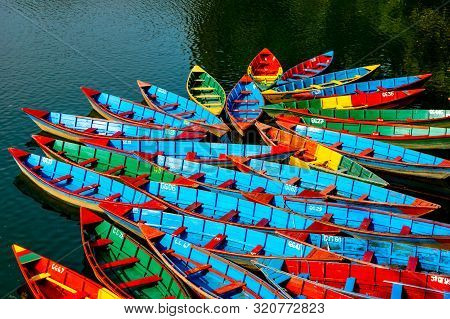 Colorful Rowboats On Lake