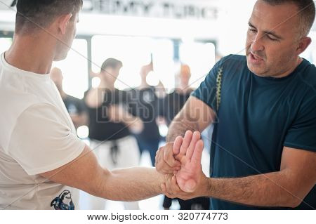 Group Of International Martial Arts Instructors And Students Have Training