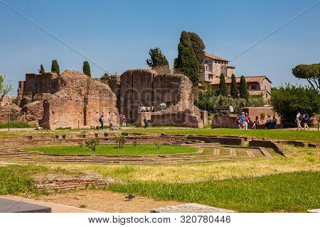 Rome, Italy - April, 2018: Tourists Visiting The Peristyle With Octagonal Island At The Flavian Pala